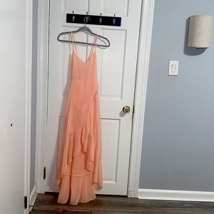 A very nice Papaya color dress, longer in the back does not longer fit me.